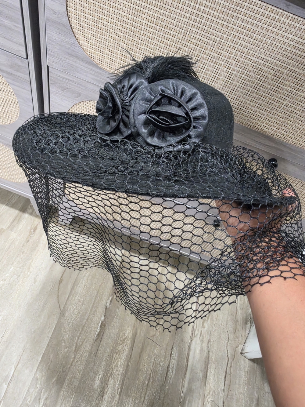 Elegant Black Veiled Hat with Rosette Accents
